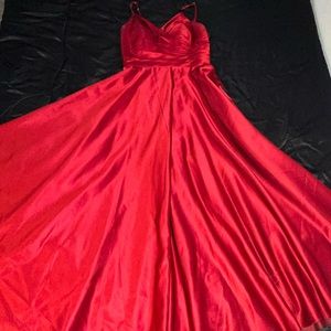 Burgundy gown with corset in the back.